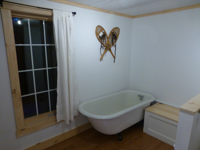 Each bathroom has a shower; one also has an antique clawfoot tub